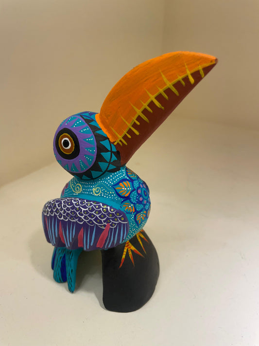 Alebrije de tucán con iconografía zapoteca – San Martín Tilcajete Oaxaca